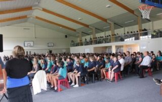 School assembly in carpeted gym